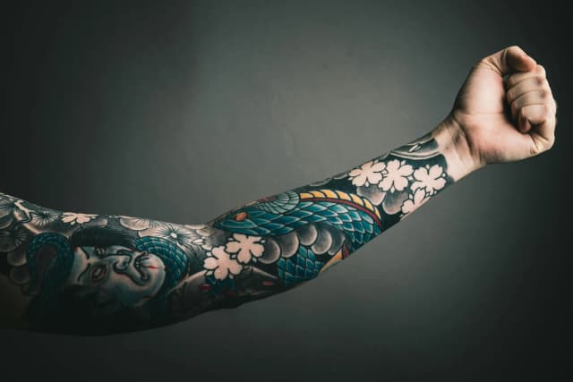 Asian arm tatoo with a high level of detail and showing the artist's skill in the traditional style.