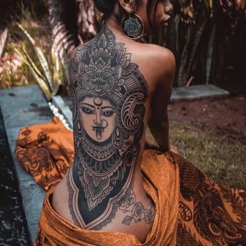 Full back tatoo of asian deity with a high level of detail and realism.