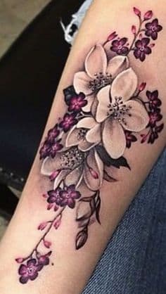 Realism flower tatoo on the arm.